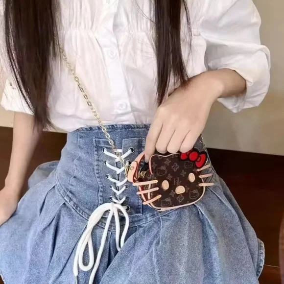 Hello Kitty Brown Monogram Mini Crossbody with Red Bow - Picture 3 of 4